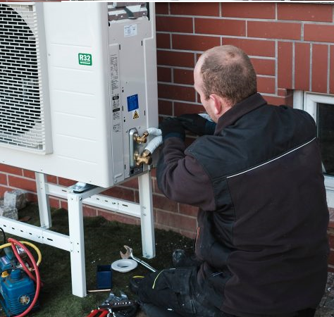 air source heat pump engineer working go green homes